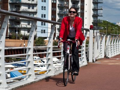 A woman cycling on Sustrans