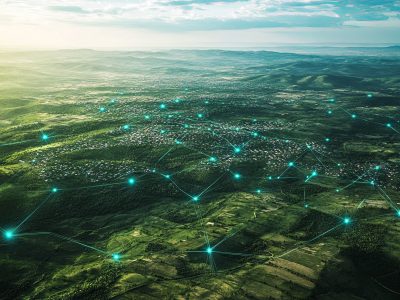 Aerial view of land featuring network markers that indicate land development planning and connectivity, highlighting potential growth areas.